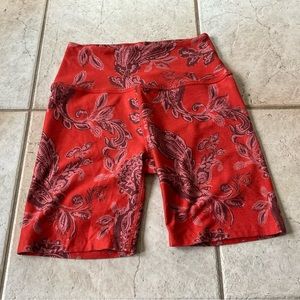 Beyond Yoga, bikers shorts, size L, burnt orange with paisley print.